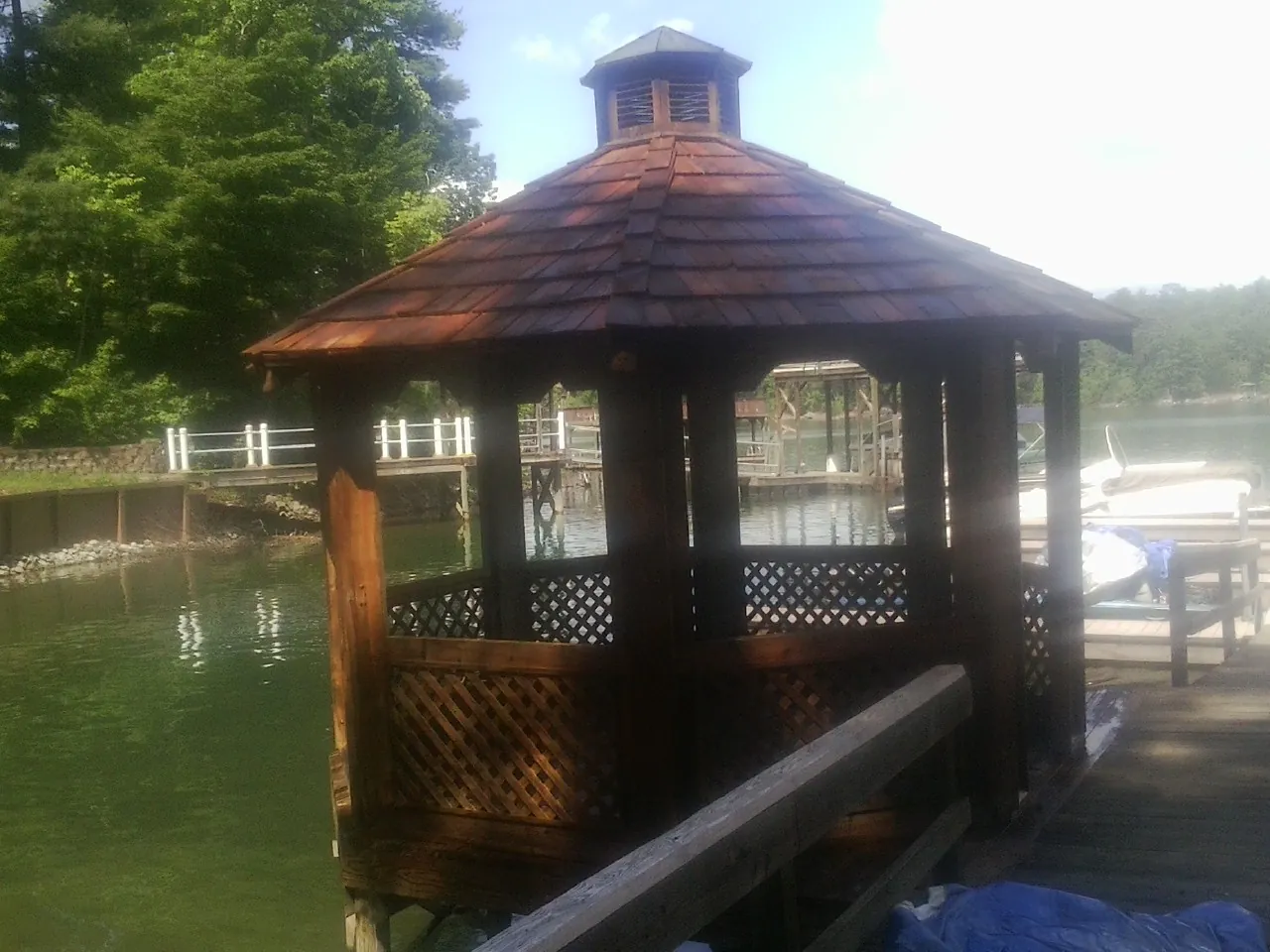 Cedar shake gazebo roof rebuilt on a lake dock in Collegeville